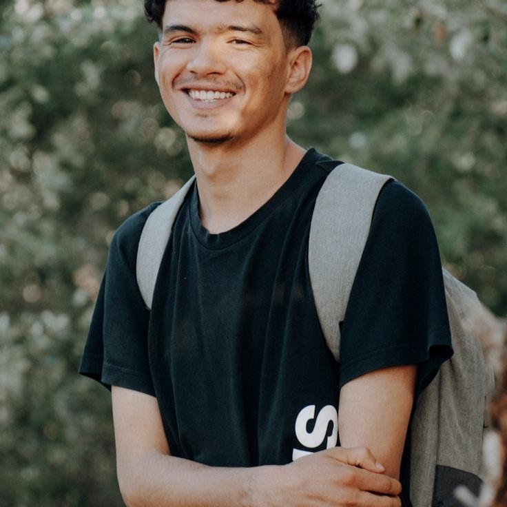 Kaveri Mehta, Lead Design Curator at New Horizon Method, reviewing corporate floral arrangements